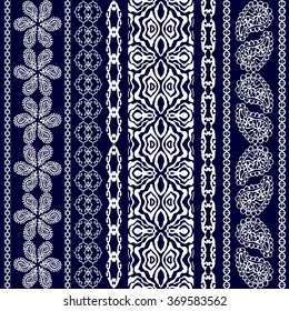 Boho style seamless pattern. Set of stripes with floral motifs, geometric borders and paisleys. Ethnic textile collection. White on dark blue. Backgrounds & textures shop.