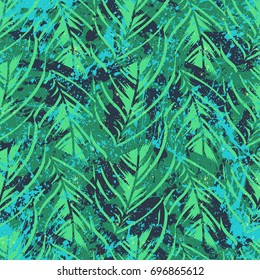 Bold abstract jungle print with silhouette of paradise island foliage. Vector seamless floral green pattern inspired by tropical nature and plants with shape of palm leave and trees. Summer background