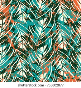 Bold abstract jungle print with silhouette of paradise island foliage. Vector seamless floral green pattern inspired by tropical nature and plants with shape of palm leave and trees. Summer background