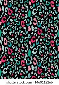 Bold leopard print. Seamless spotted texture in trendy bright turquoise, pink colors. Elegant retro pattern. Vector illustration.