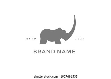 Bold and powerful illustration logo design Strongest Rhino.