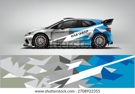 Bold rally car livery combining blue tones with gray polygons and a sharp white diagonal highlight. Perfect for racing teams, automotive branding, and high-energy car wrap artwork.
