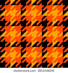 Bold seamless houndstooth pattern with layered orange and golden geometric shapes on a black background. Modern abstract textile design ideal for fabric, wallpaper, wrapping paper, and digital backgrounds.