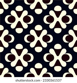 Bold and simple black and white flower pattern on a black background creates an iconic motif with peppermint like shapes.