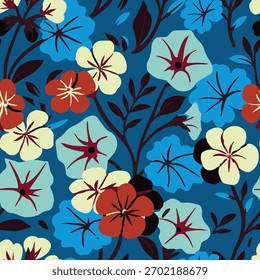 Bold tropical floral seamless pattern with colorful blue, red and yellow flowers on a dark blue background. Perfect for textiles and wallpapers.