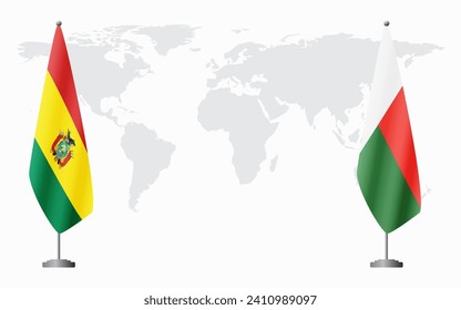 Bolivia and Madagascar flags for official meeting against background of world map.