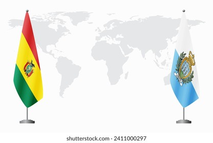 Bolivia and San Marino flags for official meeting against background of world map.