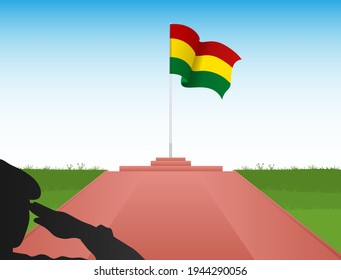 The Bolivian flag flies above the pole in the shadow of a soldier saluting the flag