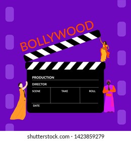 Bollywood Film Production. Clapperboard With Small Indian Tiny People Wearing Bright Colors On Film Stock Purple Background