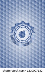 bomb icon inside blue emblem with geometric pattern background.