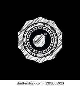 bomb icon inside chalk emblem written on a blackboard