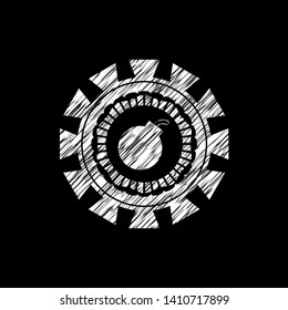 bomb icon inside chalkboard emblem written on a blackboard
