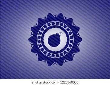 bomb icon inside emblem with jean background