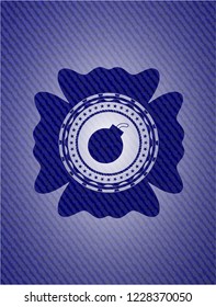 bomb icon inside emblem with jean background