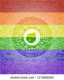 bomb icon inside emblem on mosaic background with the colors of the LGBT flag