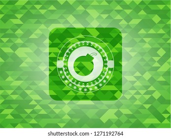 bomb icon inside green emblem with mosaic ecological style background