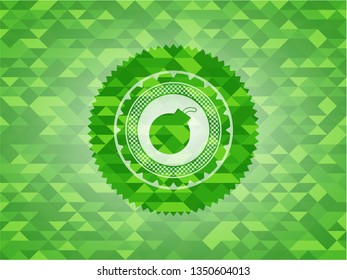 bomb icon inside green mosaic emblem
