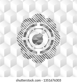 bomb icon inside grey badge with geometric cube white background