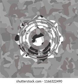 bomb icon inside grey camo emblem