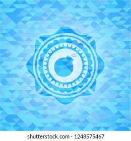 bomb icon inside light blue emblem with mosaic background