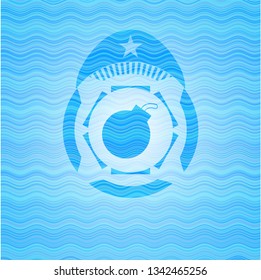 bomb icon inside light blue water style emblem.