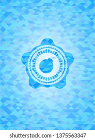 bomb icon inside light blue emblem with mosaic background