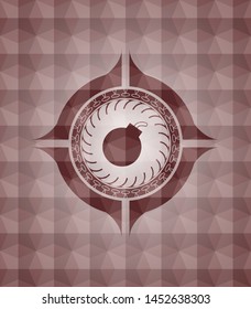 bomb icon inside red seamless badge with geometric pattern.
