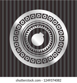 bomb icon inside silver badge or emblem