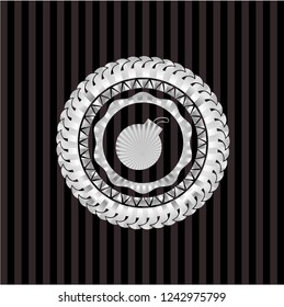 bomb icon inside silver emblem