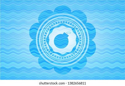 bomb icon inside sky blue water wave emblem background.