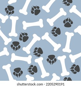 Bones and dog footprints on a blue background seamless vector pattern