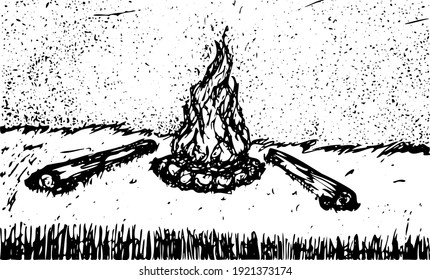 bonfire lit on a starry night in a meadow