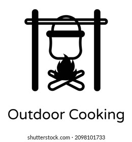 Bonfire and utensil denoting solid icon of outdoor cooking 

