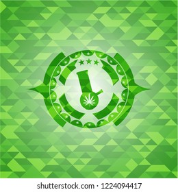 bong of marijuana icon inside green emblem with triangle mosaic background