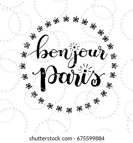 Bonjour (Hello) Paris card. Hand drawn phrase Hello Paris in french. Ink illustration. Modern brush calligraphy. Isolated on white background.