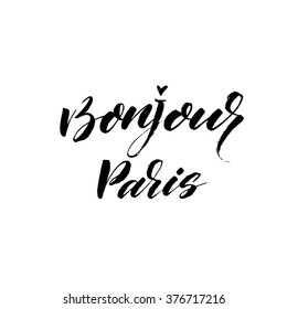 Bonjour Paris card. Hello Paris phrase in french. Ink illustration. Modern brush calligraphy. Isolated on white background. Hand drawn lettering design. 