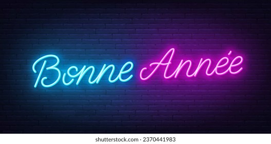 Bonne Annee neon lettering on brick wall background. Happy New Year greetings in French.