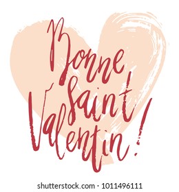 Bonne Saint Valentin Happy Valentines day handwritten brush lettering with dry brush drawn heart design.