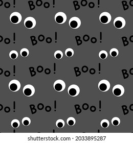 Boo typography design with scary eyes seamless pattern on dark grey background for Halloween fashion print, wallpaper, gift wrapping paper etc.