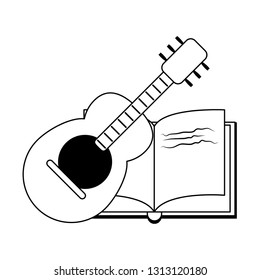 book and acoustic guitar in black and white