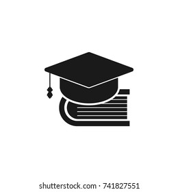 Book and bachelor hat icon on white background