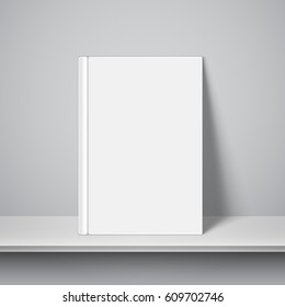 Book with empty blank cover on white bookshelf. White object mock-up or template