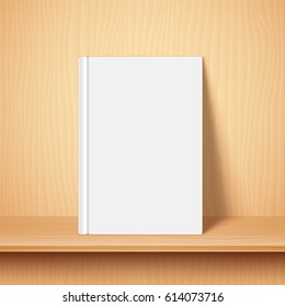 Book with empty blank cover on wooden bookshelf. White object mock-up or template