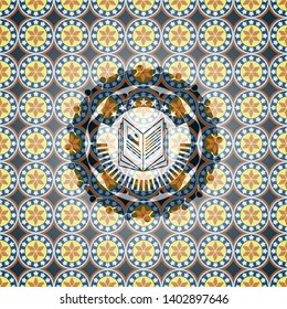 book icon inside arabic style badge. Arabesque decoration.