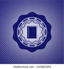 book icon inside badge with denim background