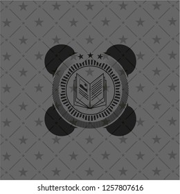 book icon inside black emblem. Vintage.