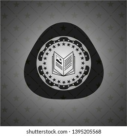 book icon inside black emblem