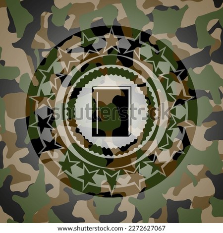 book icon inside camouflage emblem. 