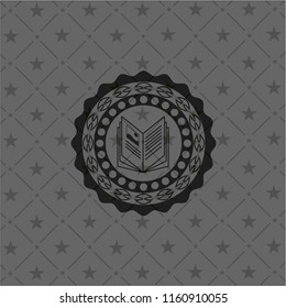 book icon inside dark badge or emblem