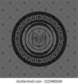 book icon inside dark badge or emblem